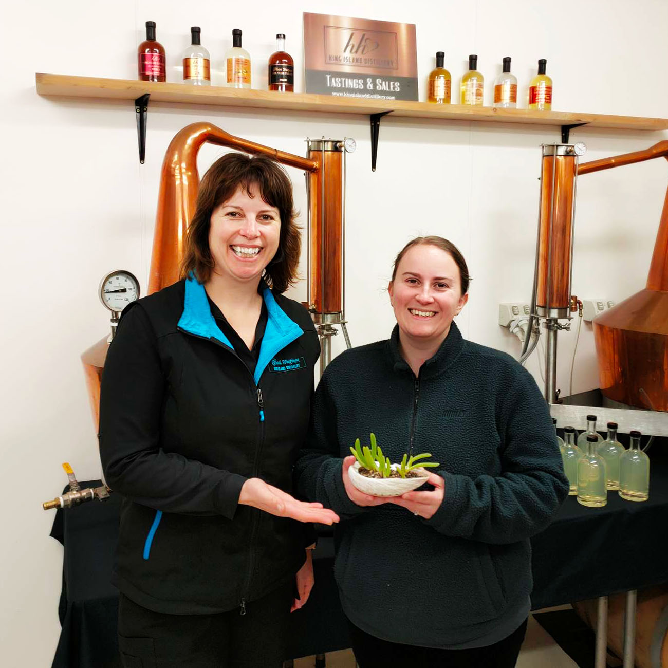 Heidi with a customer holding native succulent in abolone shell