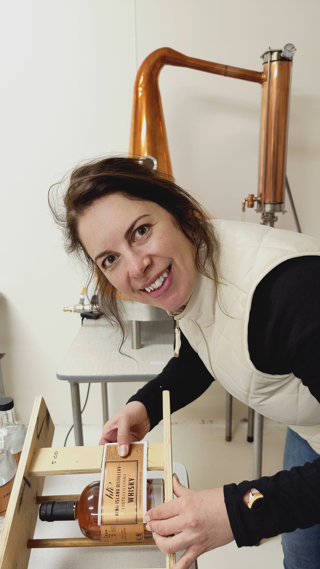 Heidi Labels the first bottle of Distiller Choice Single Malt Whisky at King Island Distillery.